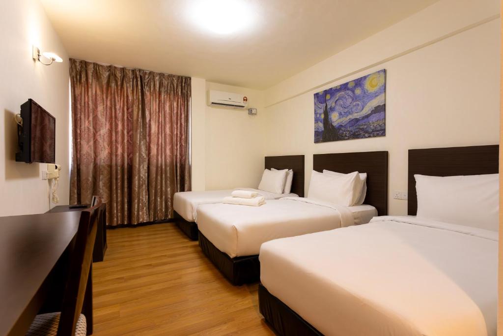 Postel nebo postele na pokoji v ubytování De Swift Hotel