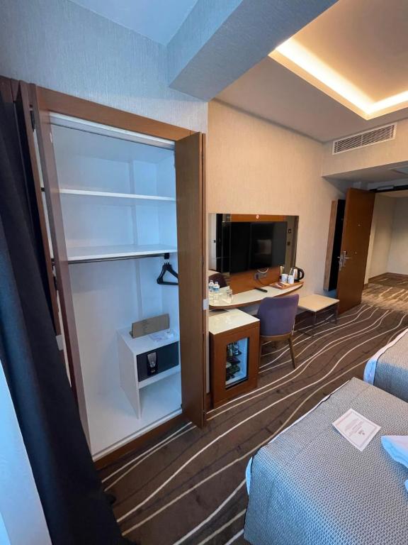 a hotel room with a bed and a desk at Cihangir Hotel Bosphorus in Istanbul