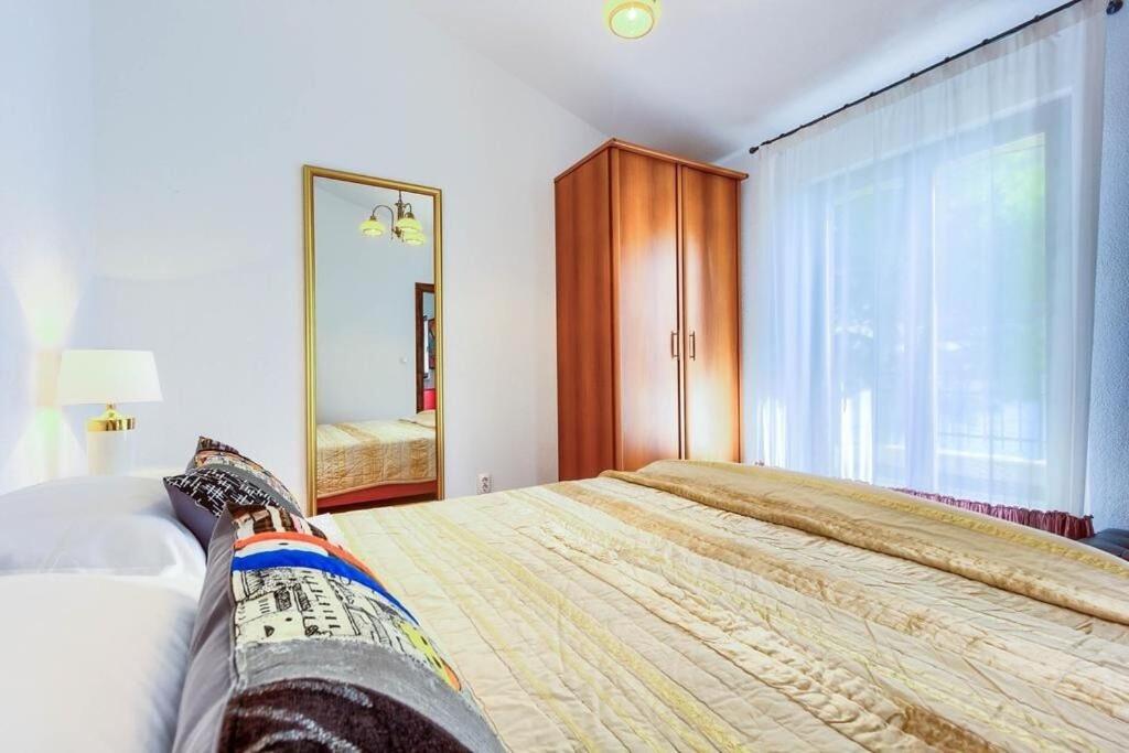 Postel nebo postele na pokoji v ubytování Apartments Lidija