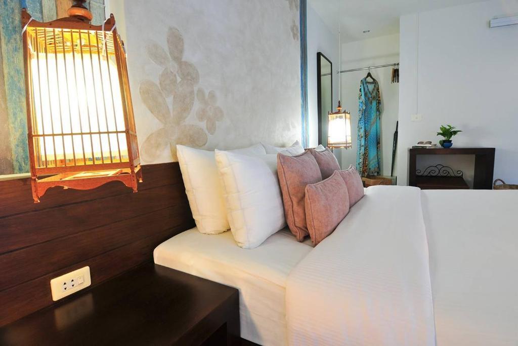 Postel nebo postele na pokoji v ubytování Palm Resort Krabi