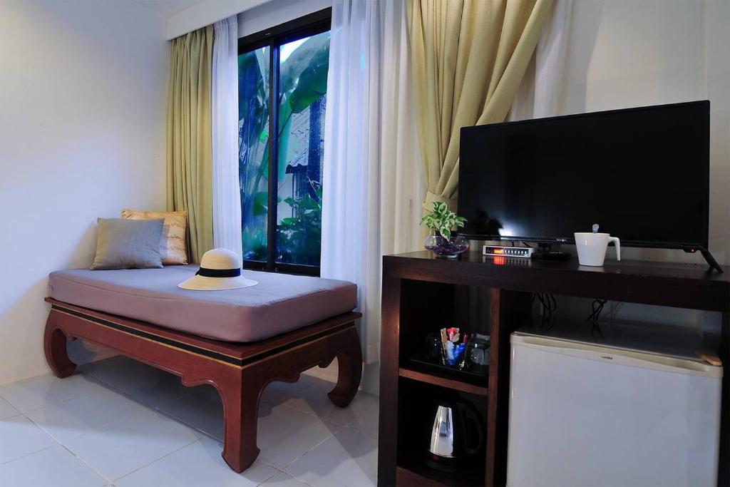 Postel nebo postele na pokoji v ubytování Palm Resort Krabi