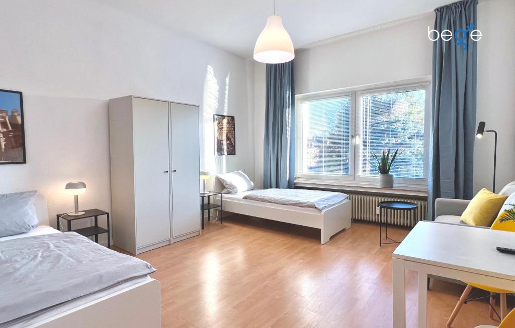 a living room with a bed and a couch at BEGE APARTMENTS Corporate Corner in Recklinghausen