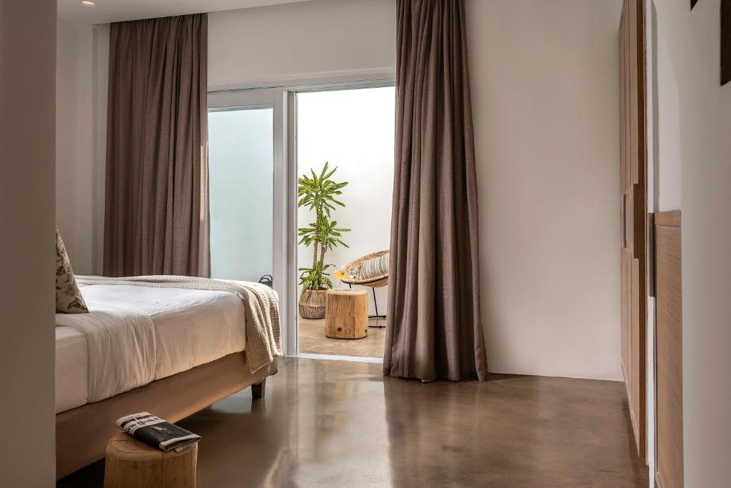 Postel nebo postele na pokoji v ubytování Andronis Arcadia Hotel