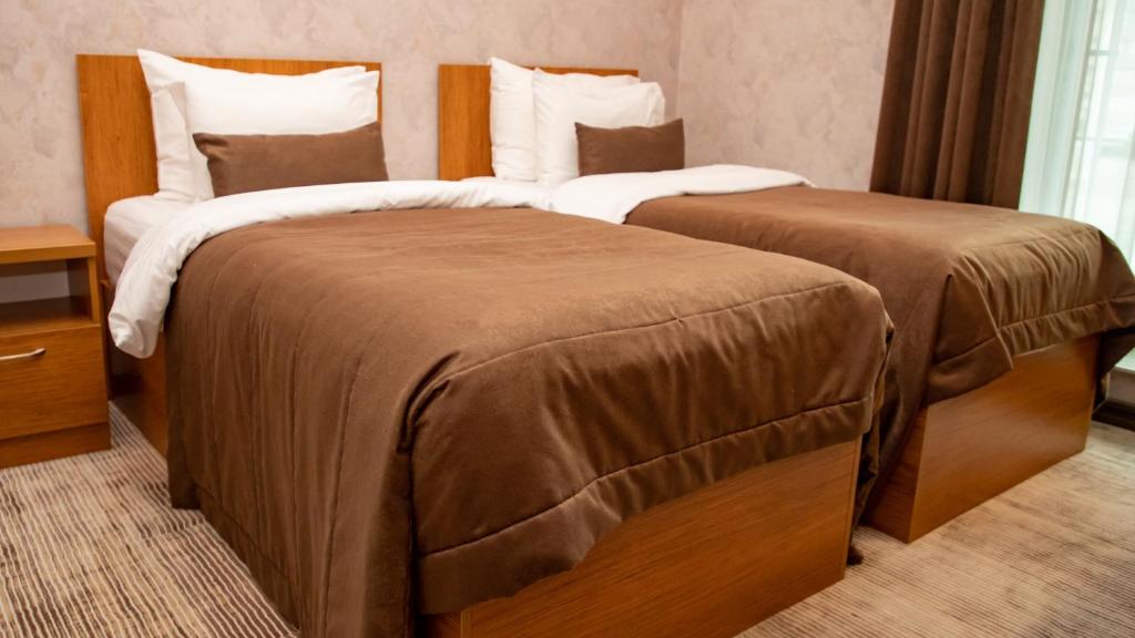 Postel nebo postele na pokoji v ubytování Midtown Hotel Baku