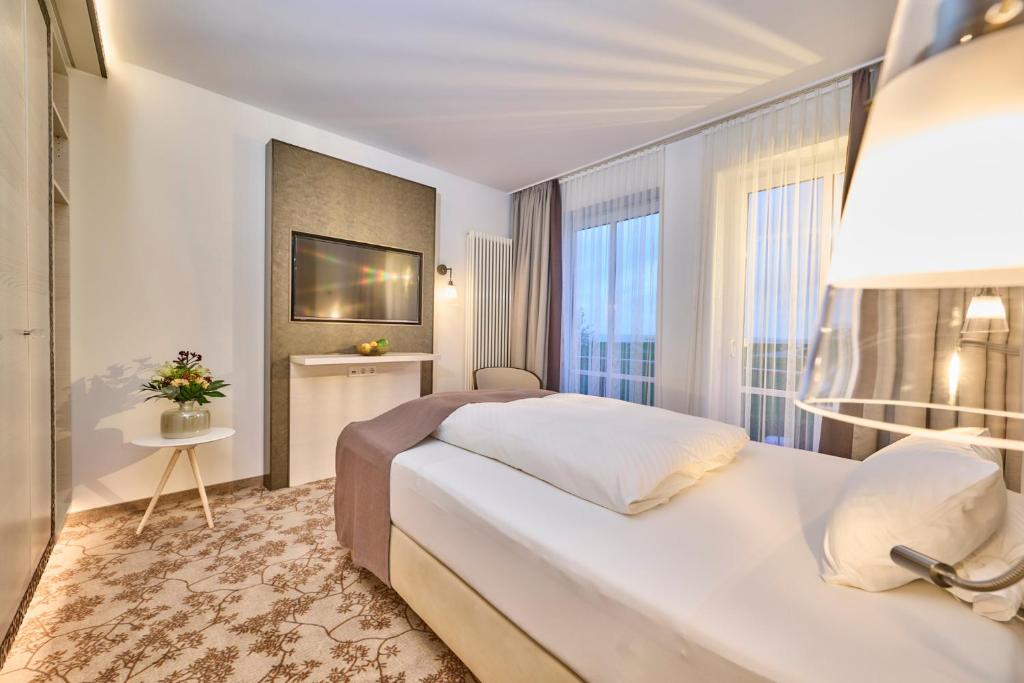 Postel nebo postele na pokoji v ubytování Janssens Hotel