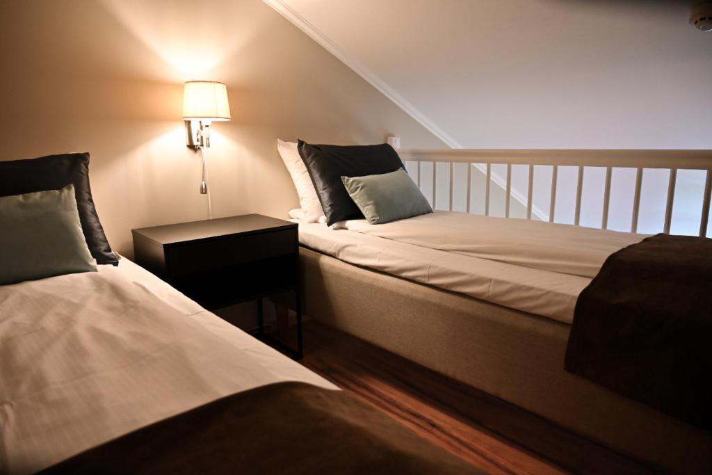Postel nebo postele na pokoji v ubytování Hotel Frøya