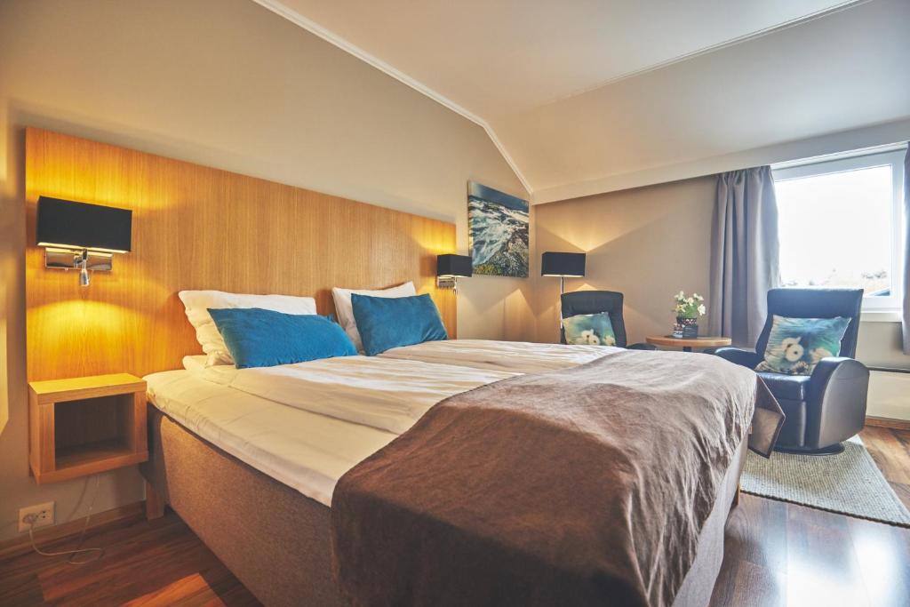 Postel nebo postele na pokoji v ubytování Hotel Frøya