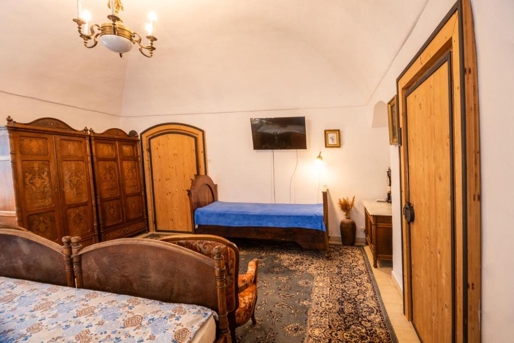 Postel nebo postele na pokoji v ubytování Zemianska Kúria Vachtár
