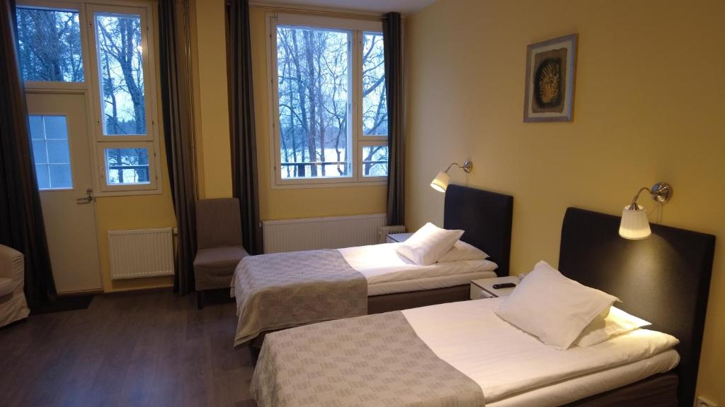 Postel nebo postele na pokoji v ubytování Lapin Satu