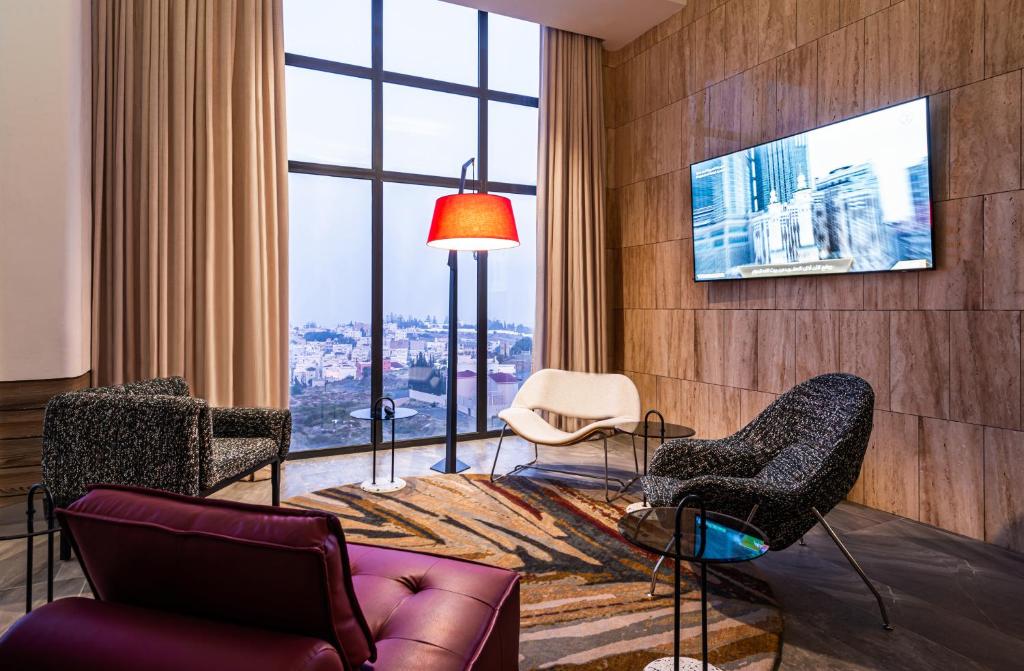 TV a/nebo společenská místnost v ubytování Ewaa Express Hotel - Abha