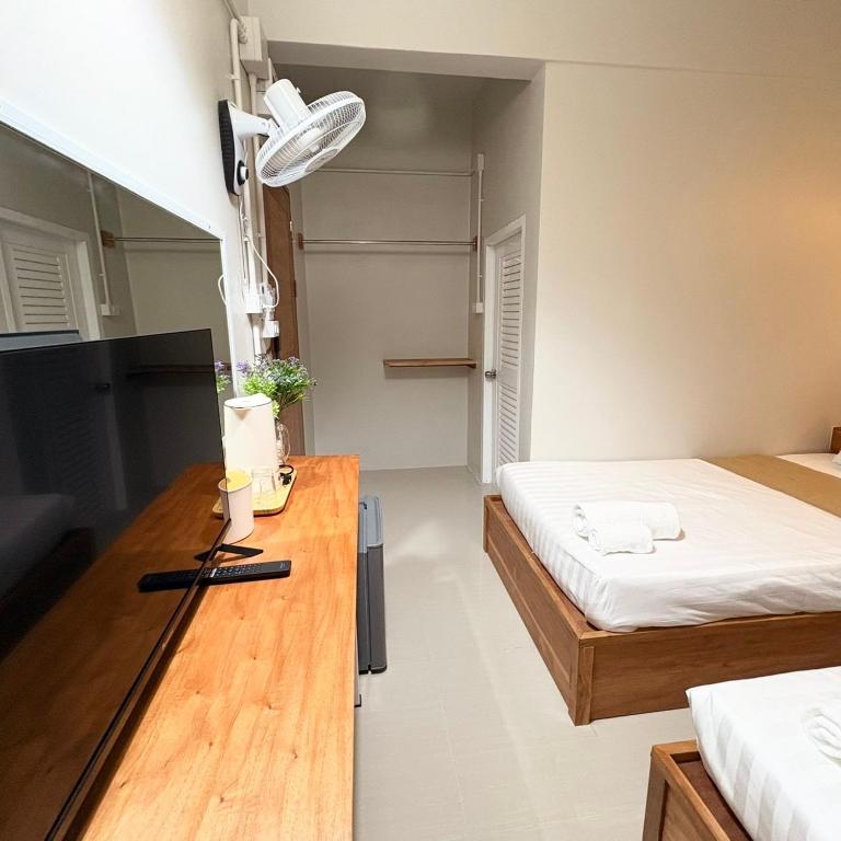 Postel nebo postele na pokoji v ubytování Yoi Hotel krabi