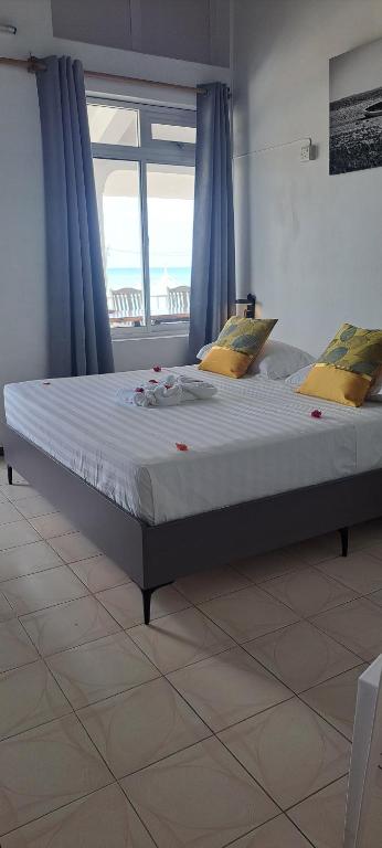 Postel nebo postele na pokoji v ubytování La Plage Residence
