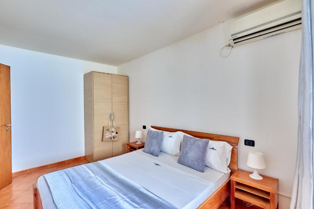 Postel nebo postele na pokoji v ubytování Patio Antigo Residence