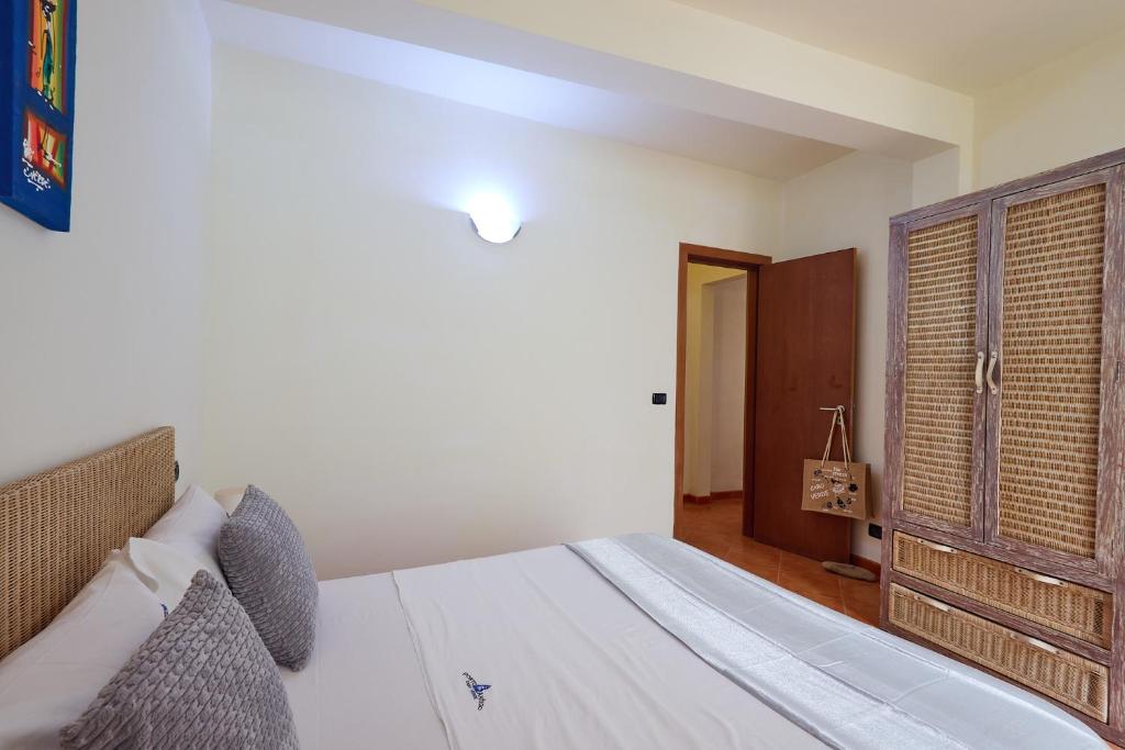 Postel nebo postele na pokoji v ubytování Patio Antigo Residence