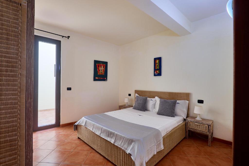 Postel nebo postele na pokoji v ubytování Patio Antigo Residence