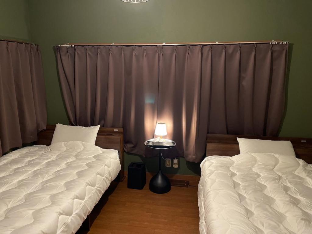 Postel nebo postele na pokoji v ubytování シュネール北軽井沢