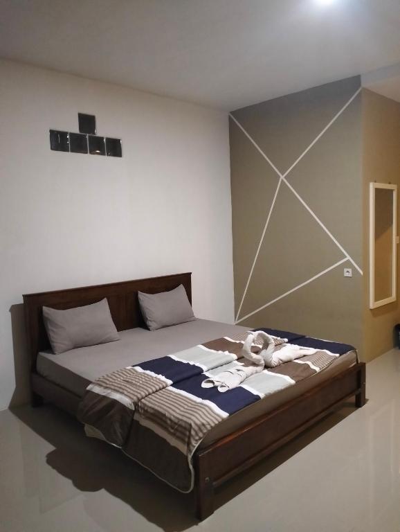 Postel nebo postele na pokoji v ubytování G-Rima Home Stay