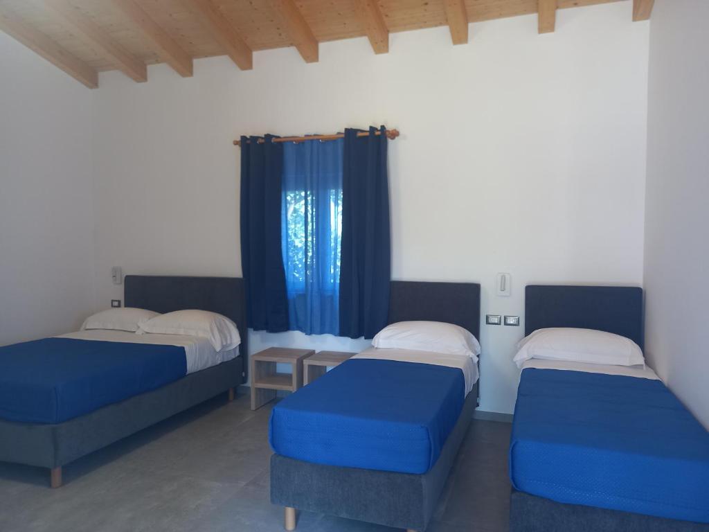 Postel nebo postele na pokoji v ubytování Agriturismo Lumia Resort