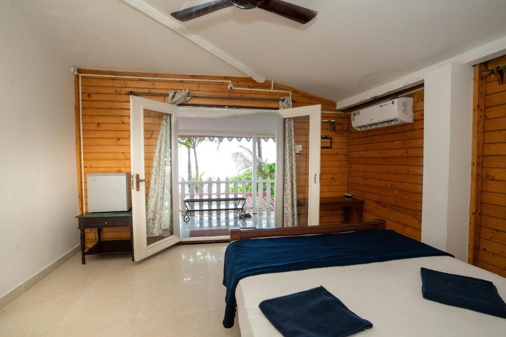 Postel nebo postele na pokoji v ubytování Nasya Beachside Cottages