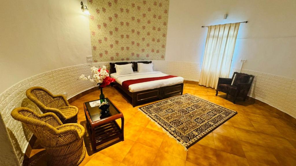 Postel nebo postele na pokoji v ubytování Coorg Heritage Hill View Resort