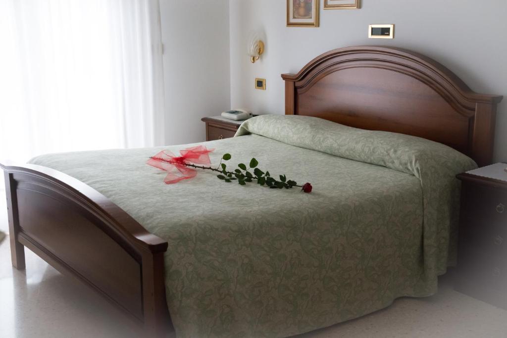 Postel nebo postele na pokoji v ubytování Hotel Da Gigi