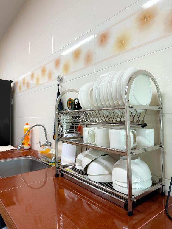 Postel nebo postele na pokoji v ubytování Happy Guest House Nibong Tebal 开心民宿高渊区