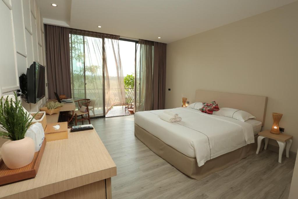 Postel nebo postele na pokoji v ubytování Navela Hotel & Convention