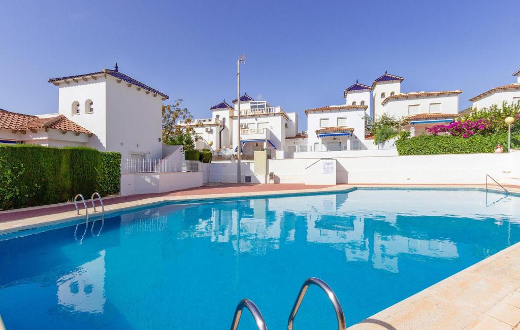 ein Pool vor einigen Gebäuden in der Unterkunft 3 Bedroom Lovely Home In Cartagena in Cartagena