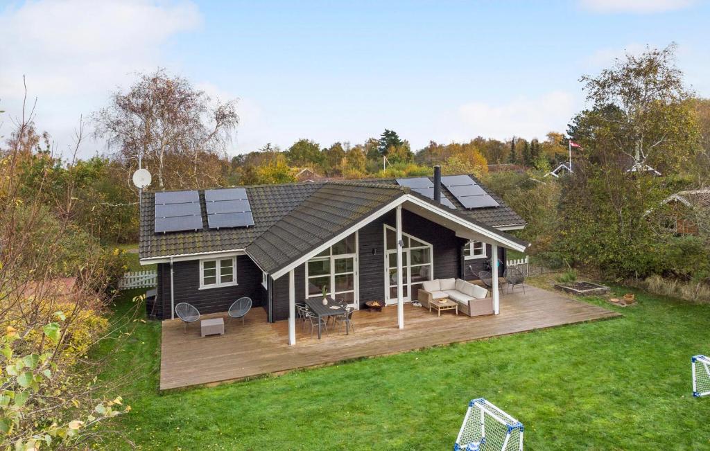 an overhead view of a house with a deck at Lovely Home In Dannemare With Sauna in Dannemare