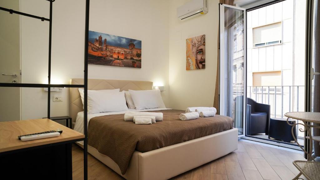 Postel nebo postele na pokoji v ubytování Bieddu Suites