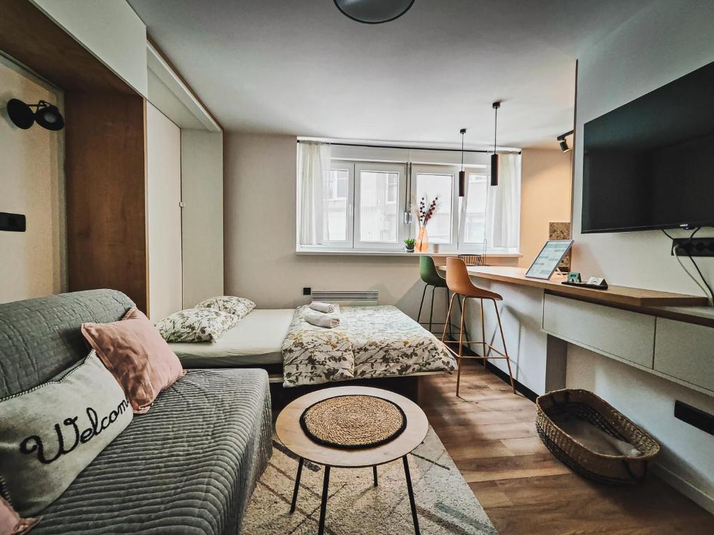 a living room with a couch and a table at Teka’s home in Sarajevo