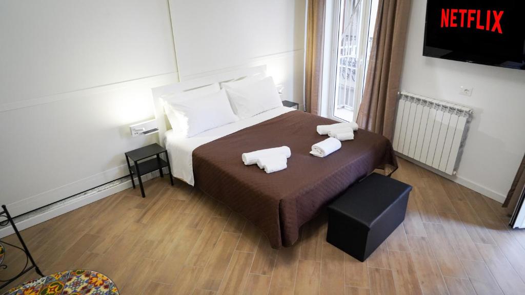 Postel nebo postele na pokoji v ubytování Bieddu Suites