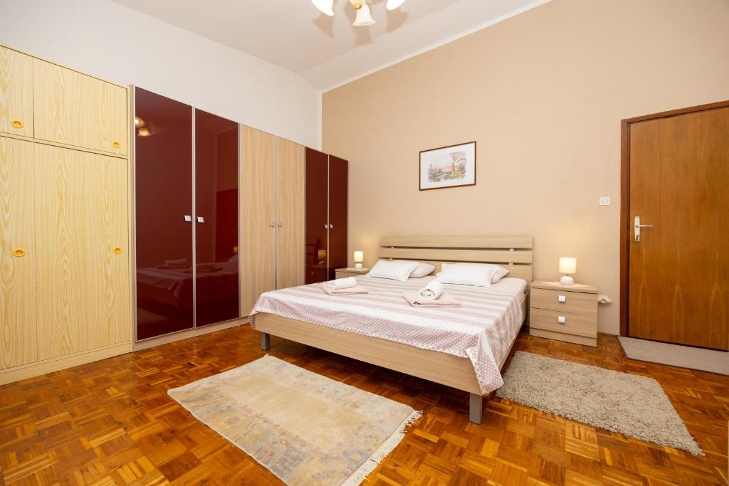 Posteľ alebo postele v izbe v ubytovaní Apartman Seashell