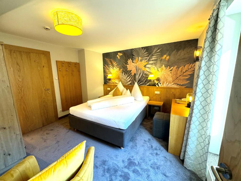 Postel nebo postele na pokoji v ubytování Hotel Dr Otto Murr B&B