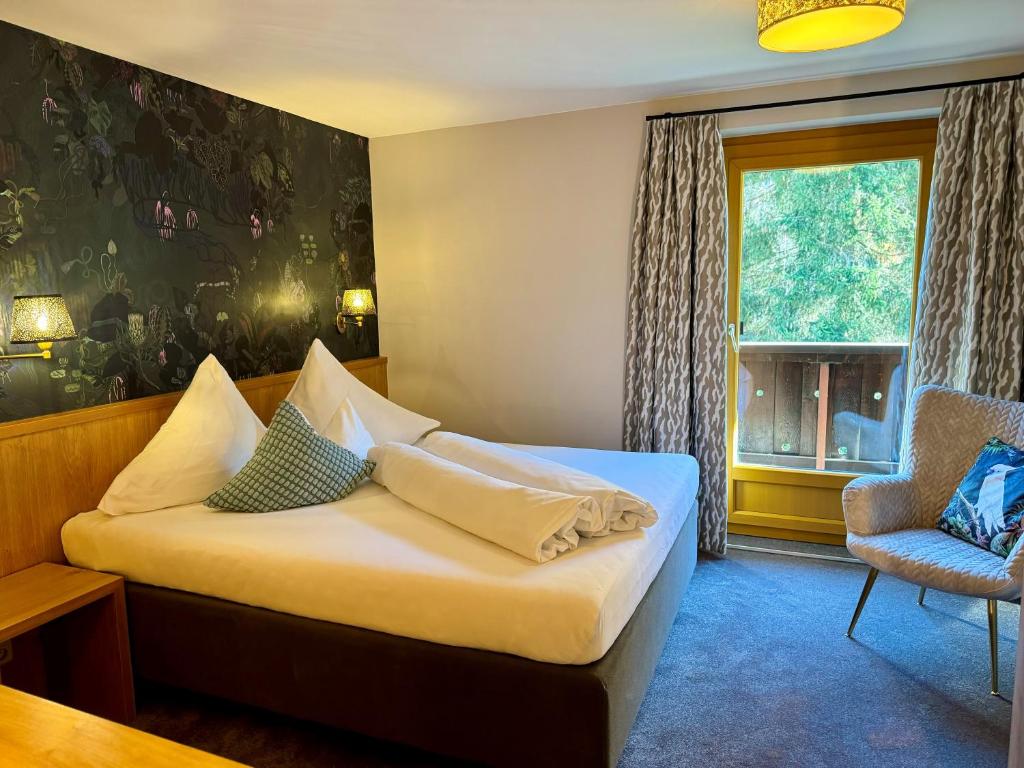 Postel nebo postele na pokoji v ubytování Hotel Dr Otto Murr B&B