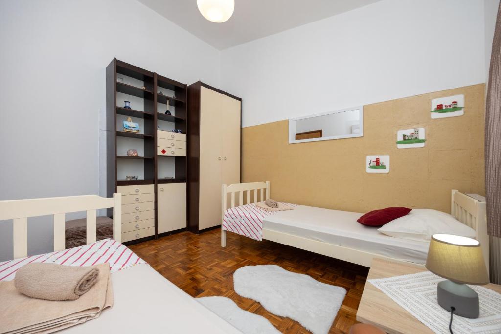 Posteľ alebo postele v izbe v ubytovaní Apartman Seashell