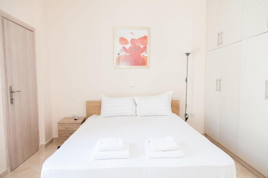 Postel nebo postele na pokoji v ubytování Great Apartment in Piraeus