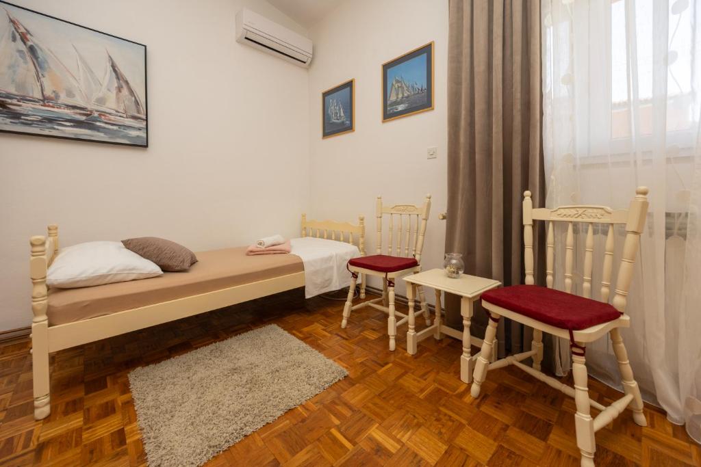 Posteľ alebo postele v izbe v ubytovaní Apartman Seashell