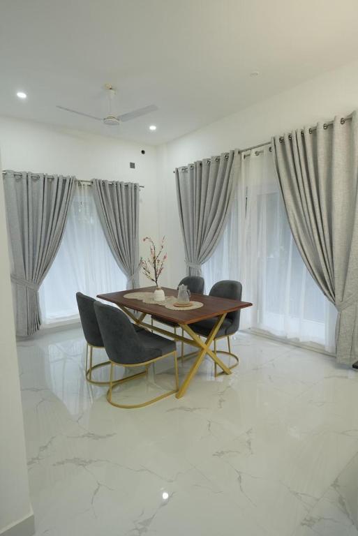 Posezení v ubytování Rivera Residency Trivandrum