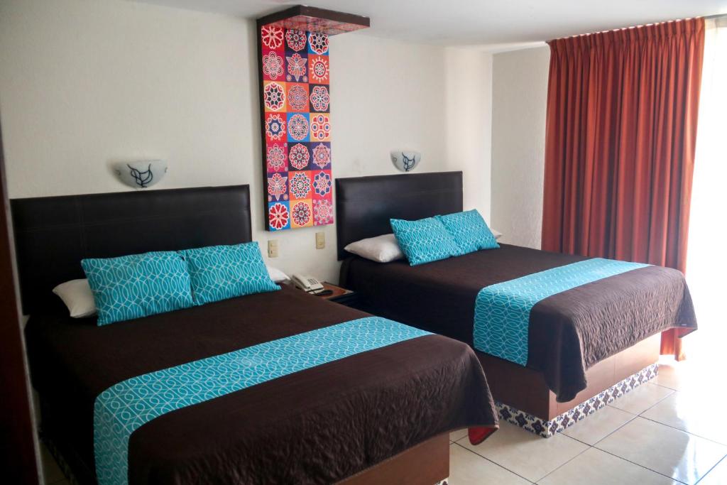 Postel nebo postele na pokoji v ubytování VF Villa Florencia Hotel