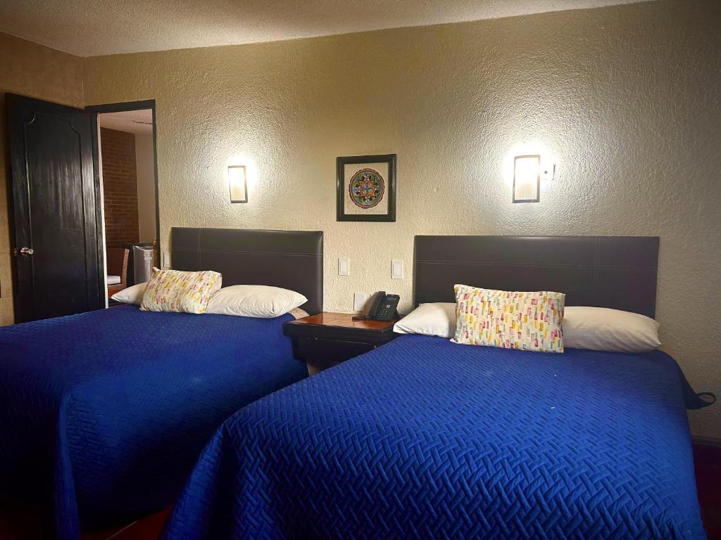 Postel nebo postele na pokoji v ubytování VF Villa Florencia Hotel