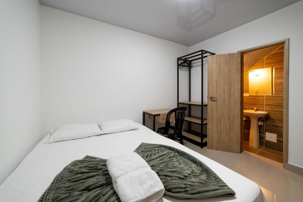Postel nebo postele na pokoji v ubytování Hotel Doxa