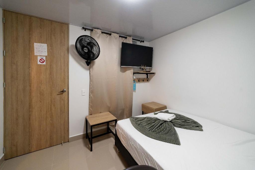 Postel nebo postele na pokoji v ubytování Hotel Doxa