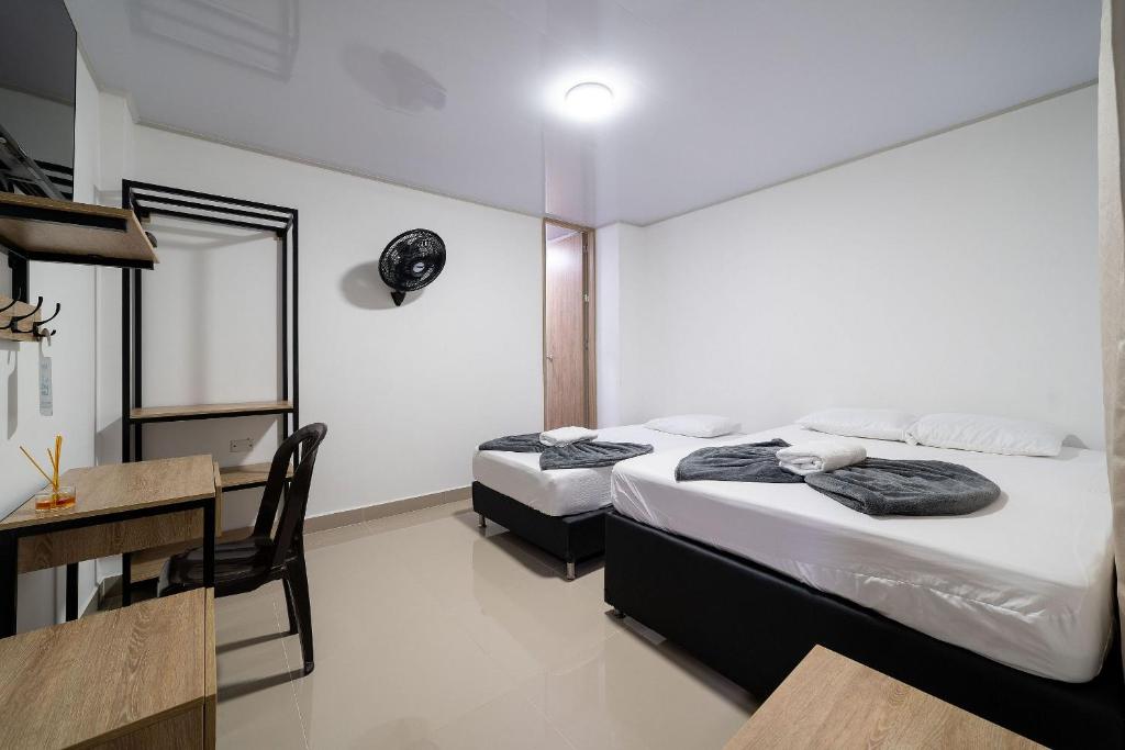 Postel nebo postele na pokoji v ubytování Hotel Doxa