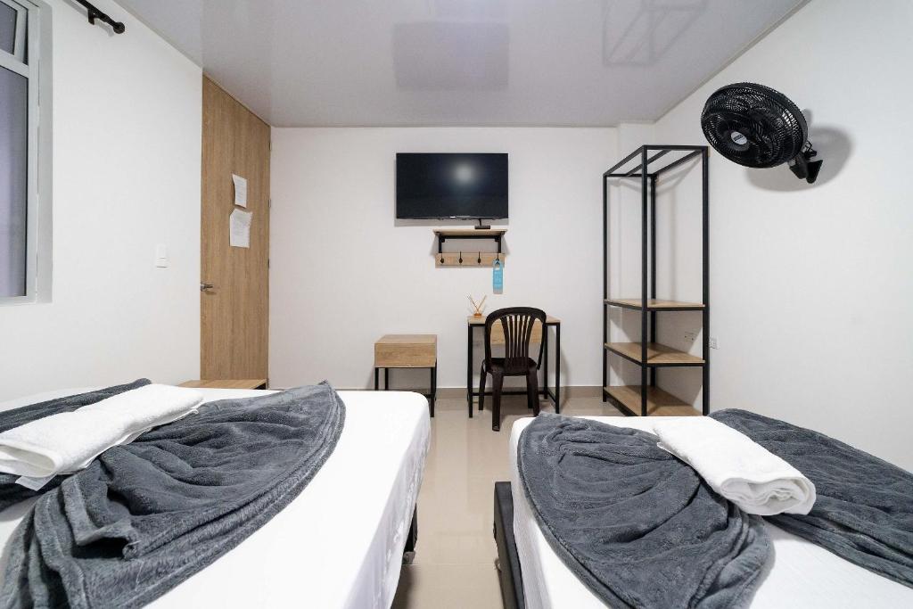 Postel nebo postele na pokoji v ubytování Hotel Doxa