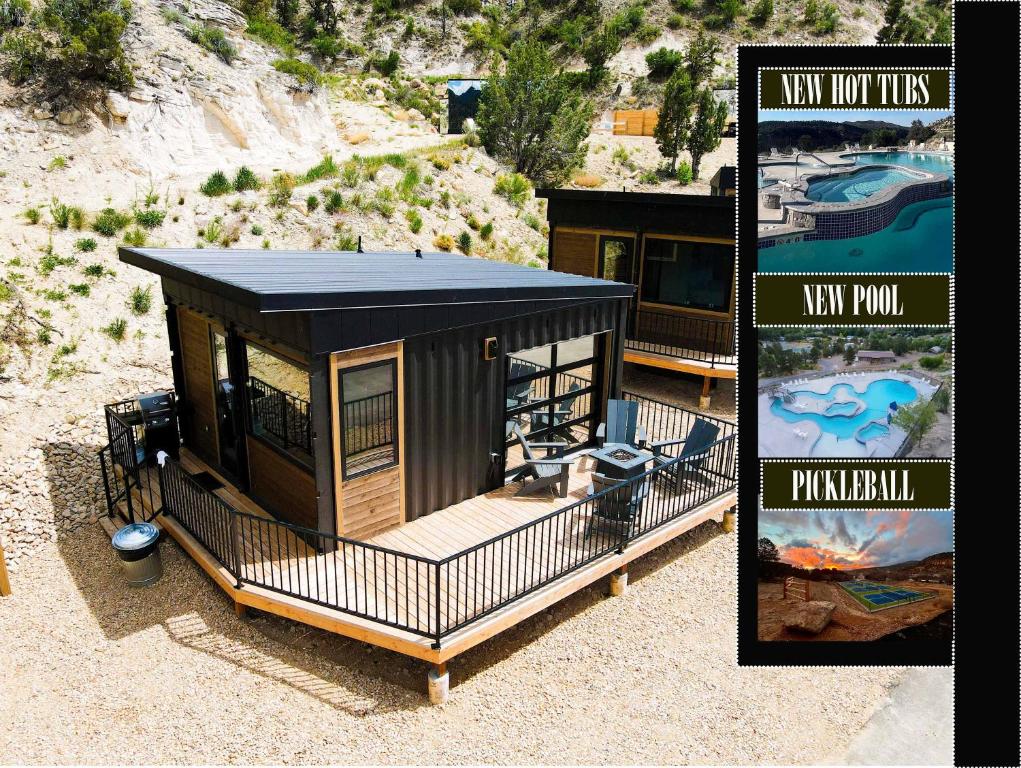 a rendering of a tiny house with a black roof at Iron Cliff in Orderville