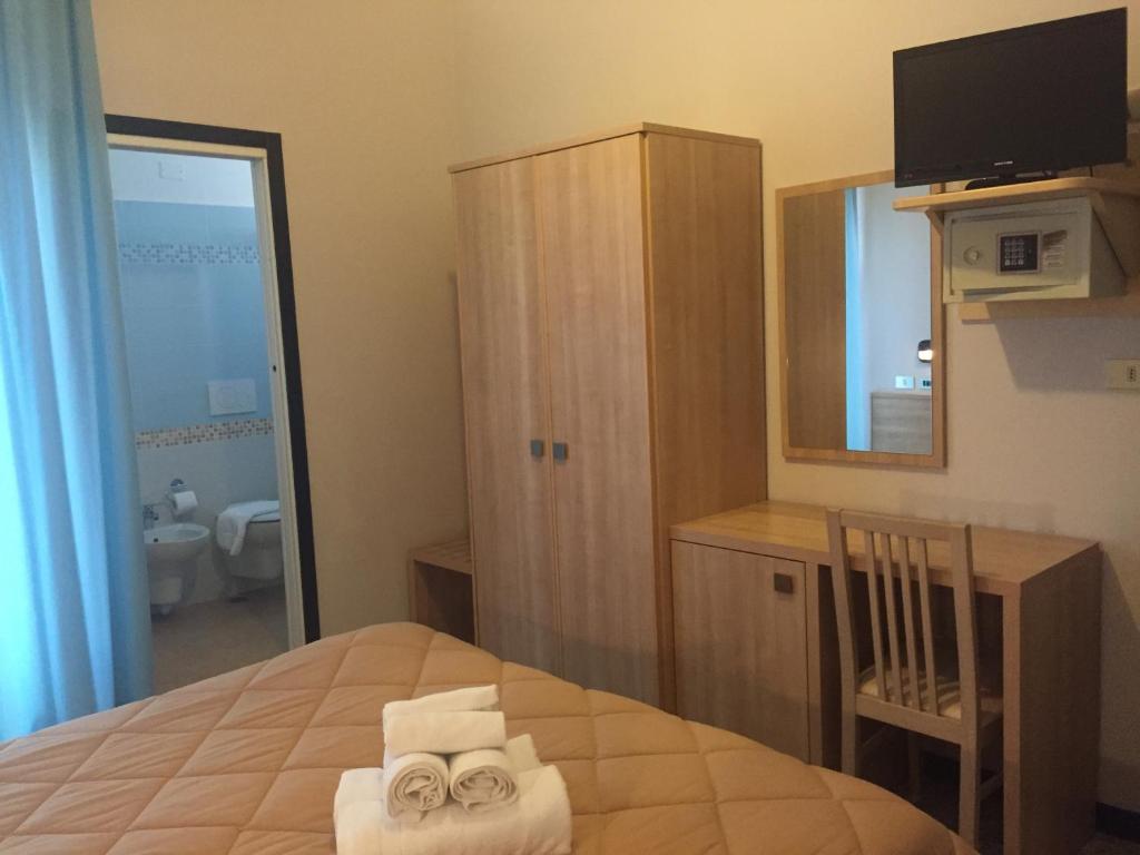 Postel nebo postele na pokoji v ubytování Abc Hotel