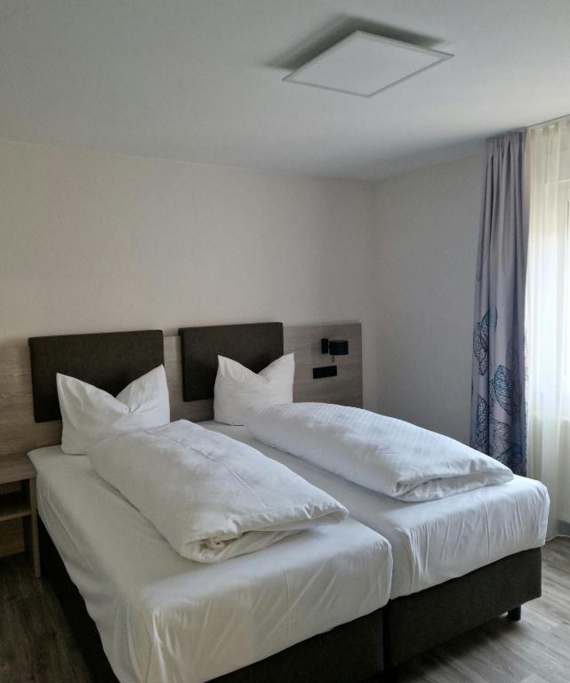 Postel nebo postele na pokoji v ubytování Hotel Alte Bäckerei