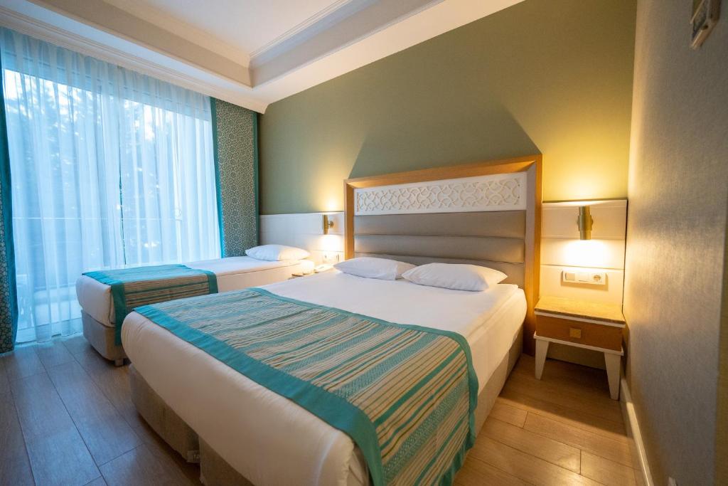Postel nebo postele na pokoji v ubytování Karmir Resort & Spa - Ultra All Inclusive