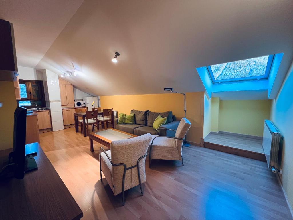 a living room with a couch and a table at Apartamento Espata VII in Villanúa